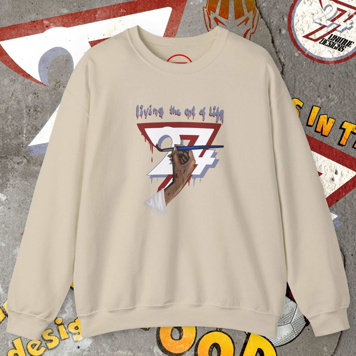 Beige artist brush sweatshirt with hand-drawn bohemian design and "living the art of life" text