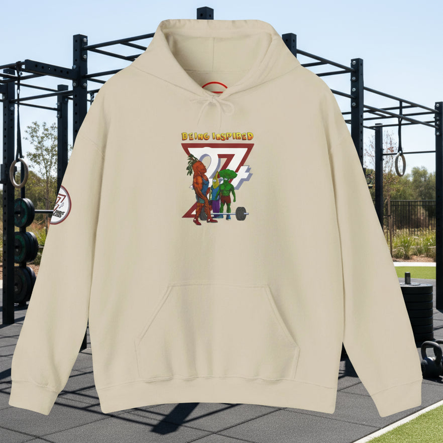 Beige custom hoodie with banana and broccoli comic workout characters and "Being Inspired" text design.