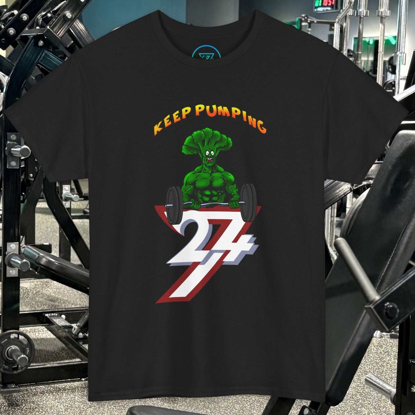 Black Broccoli Weightlifting Cartoon T-Shirt with muscle broccoli lifting weights and "Keep Pumping 24/7" text, gym fitness tee design