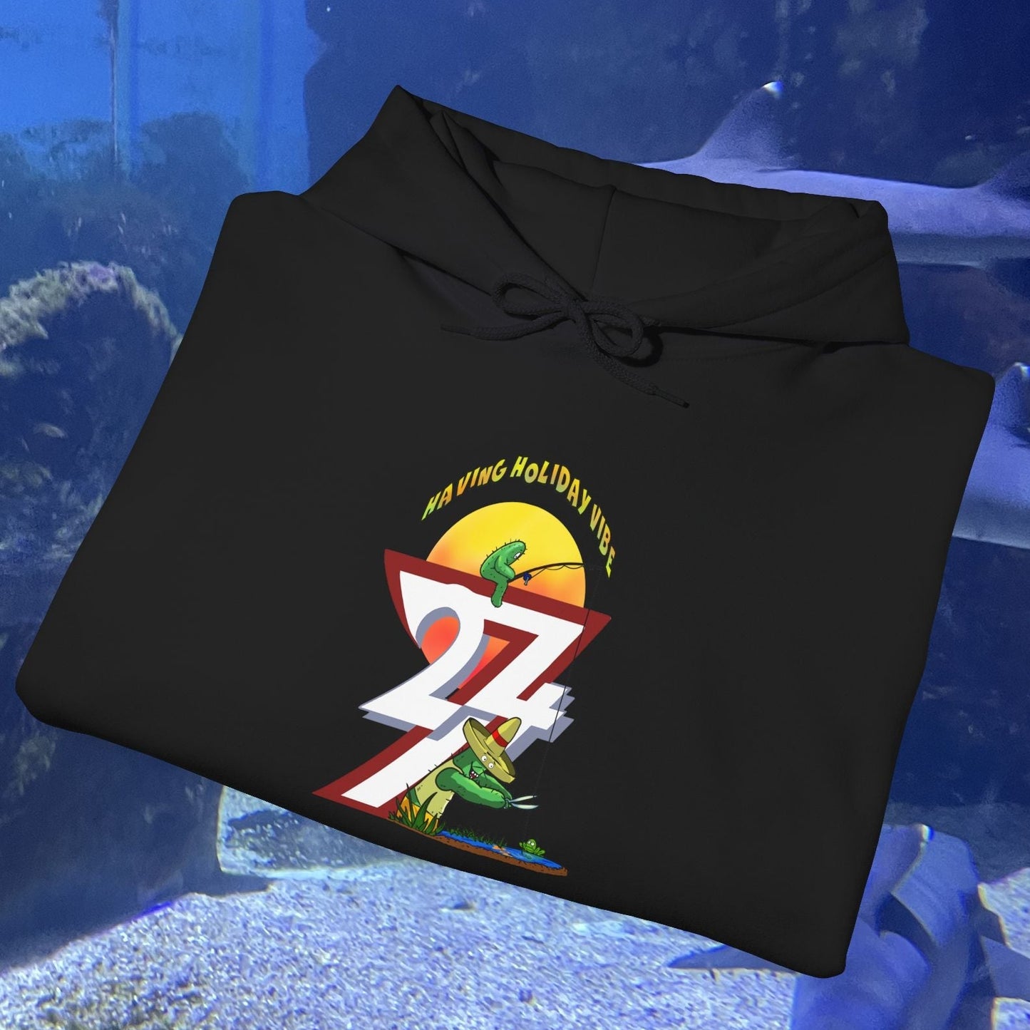 Black Funny Fishing Hoodie with colorful cactus and fishing design, summer holiday theme jumper, folded on aquarium background