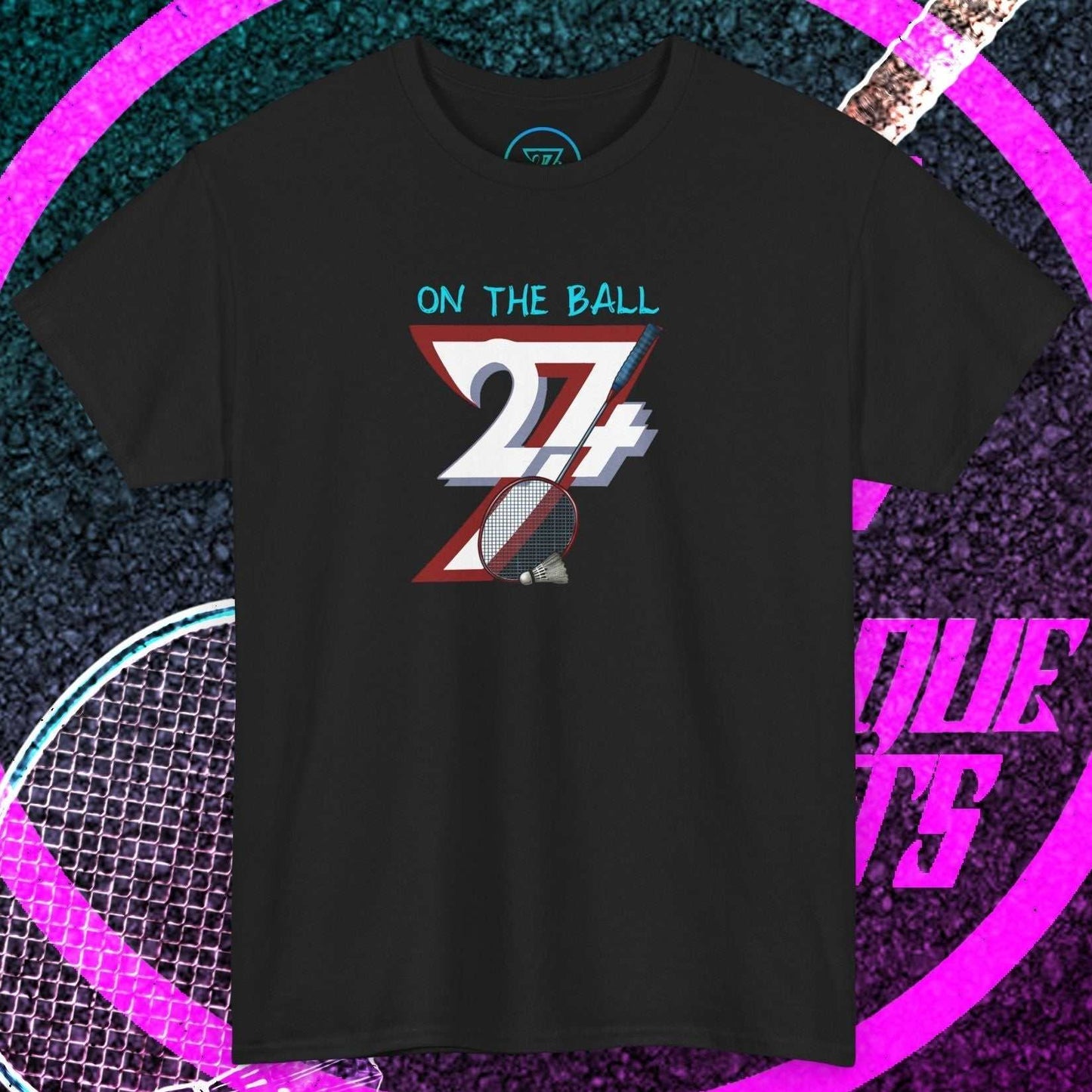 Black badminton graphic tee with hand-drawn style "On The Ball 24/7" design, classic crew neck, smooth cotton fabric, and reinforced shoulders.