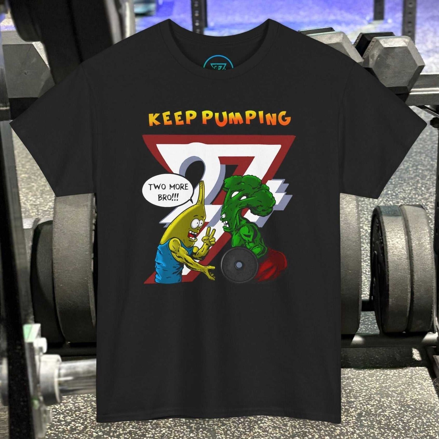 Black broccoli gym tee with cartoon broccoli and banana characters lifting weights and "Keep Pumping" text