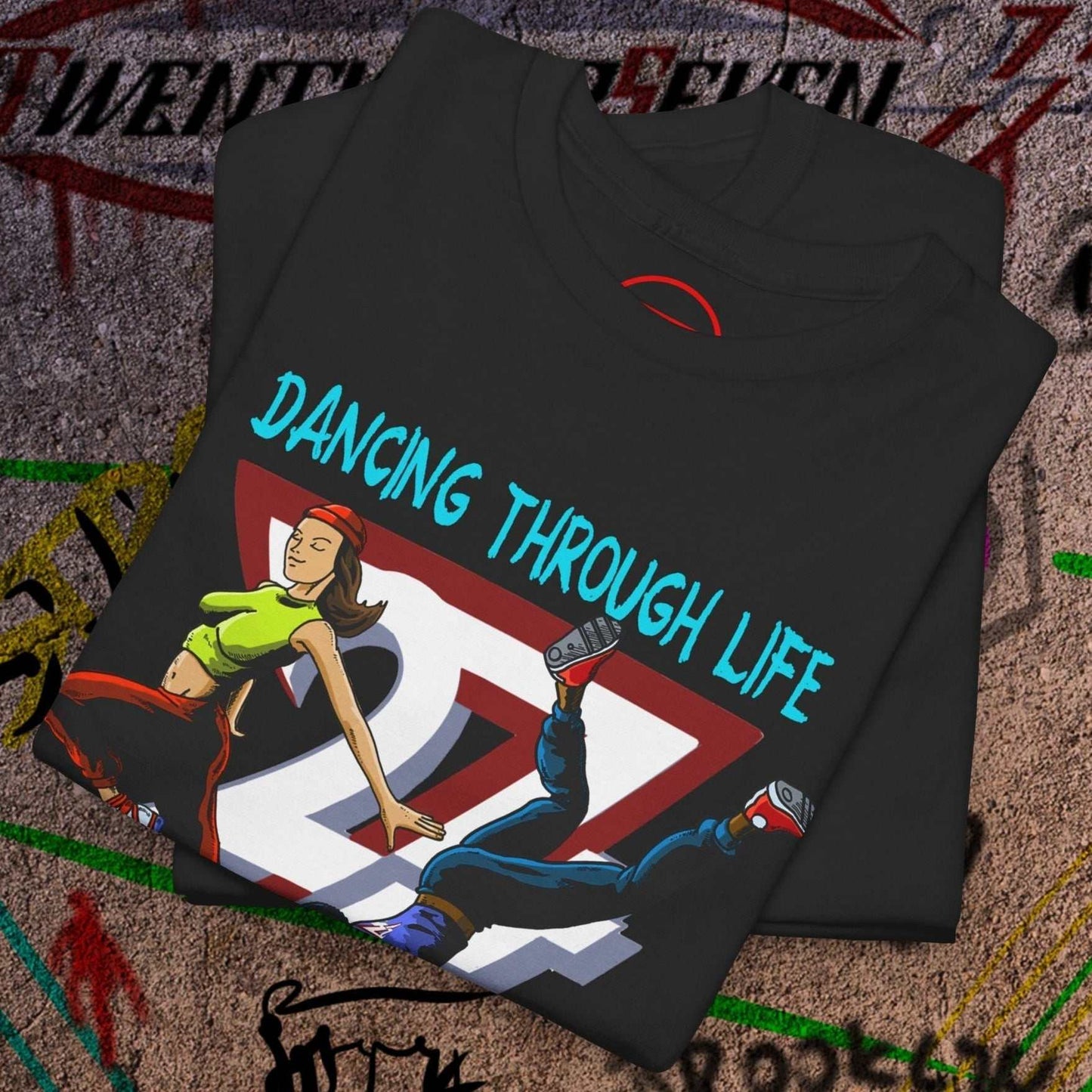 Black dance t-shirt with colorful 90s funky comic-style dancing duo graphic and "Dancing Through Life" text