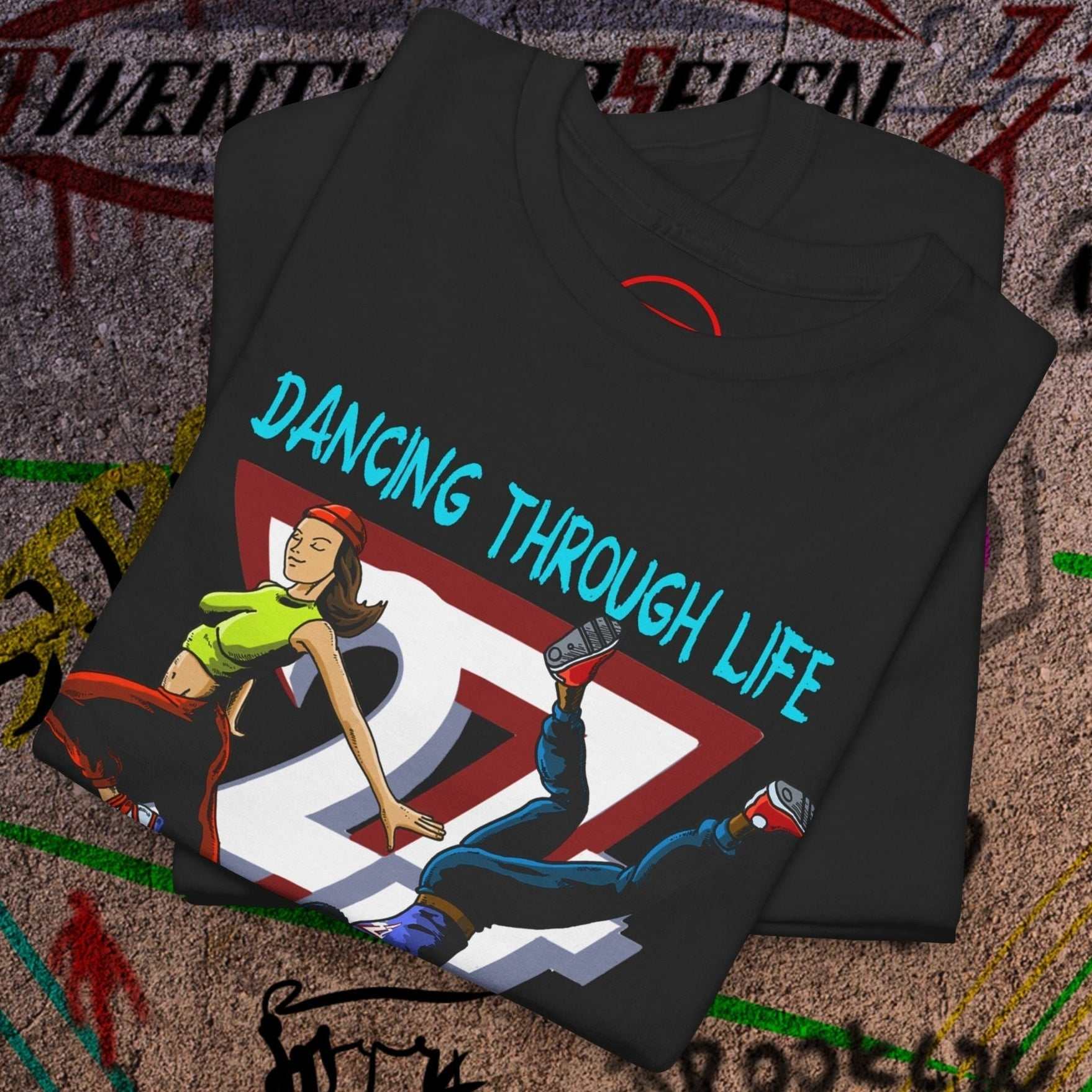 Black dance t-shirt with colorful 90s funky comic-style dancing duo graphic and "Dancing Through Life" text
