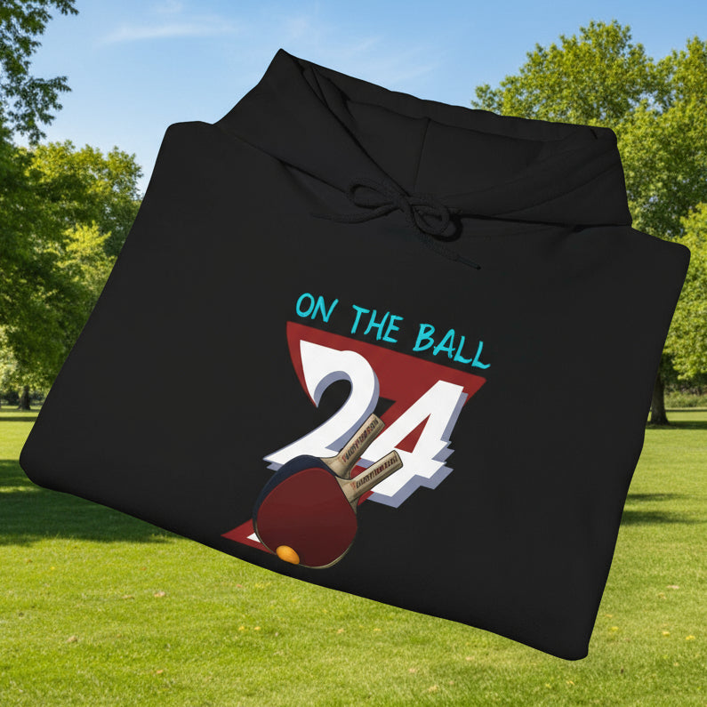 Black ping pong hoodie with hand-drawn paddles and "On the Ball 27" design, cozy and sporty style