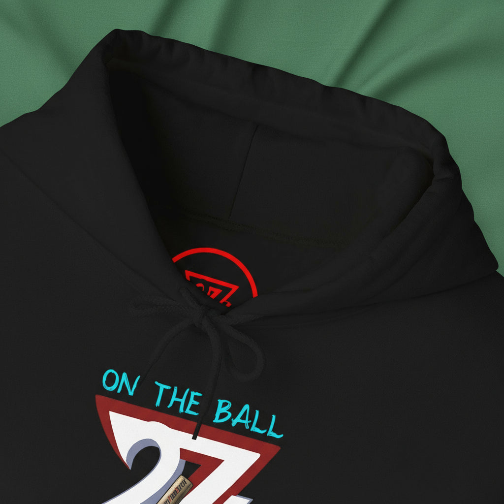 Black ping pong hoodie with hand-drawn "On The Ball" design and adjustable drawstring hood