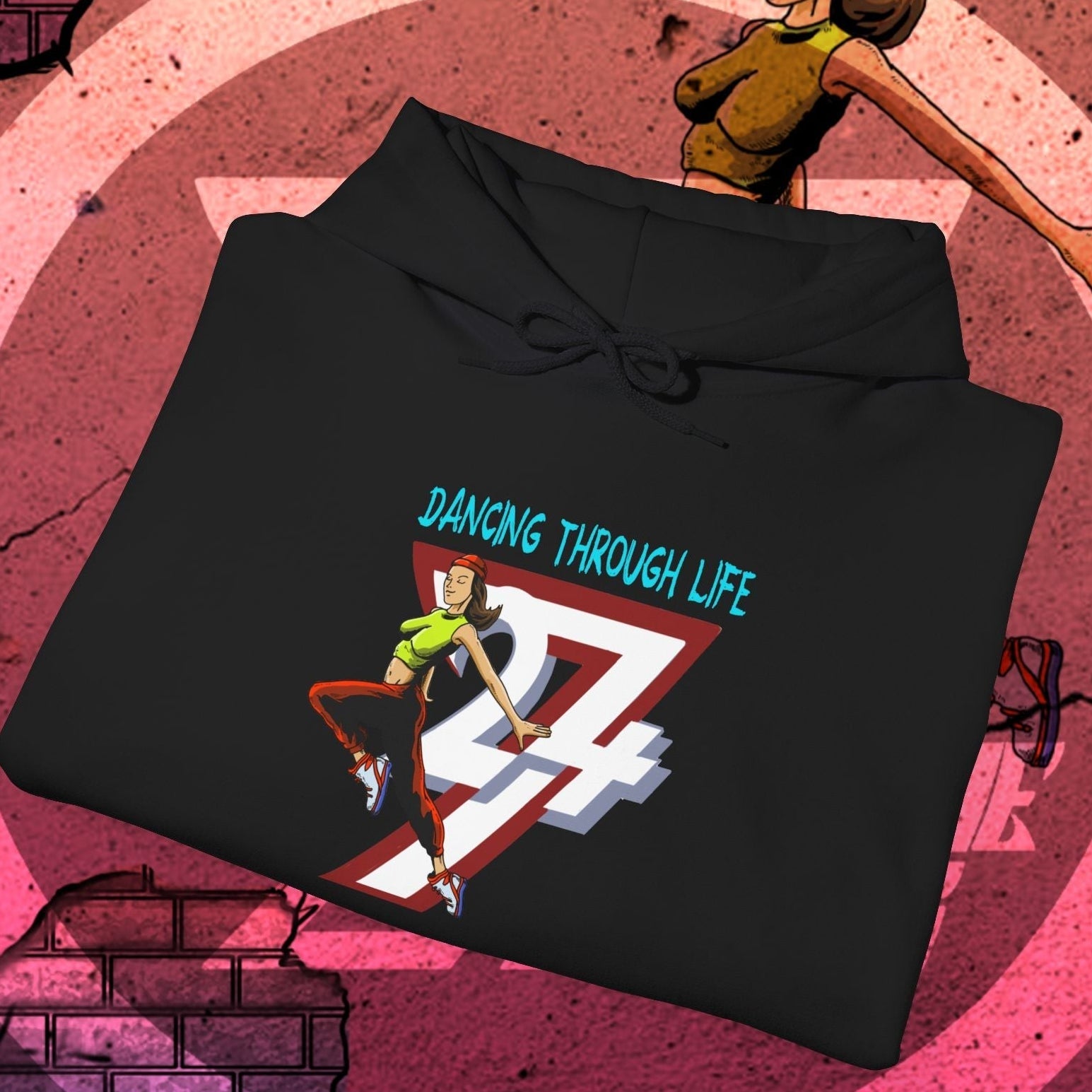 Black street dance hoodie for women with colorful dancing graphic and "Dancing Through Life" text, urban style and comfortable fit.