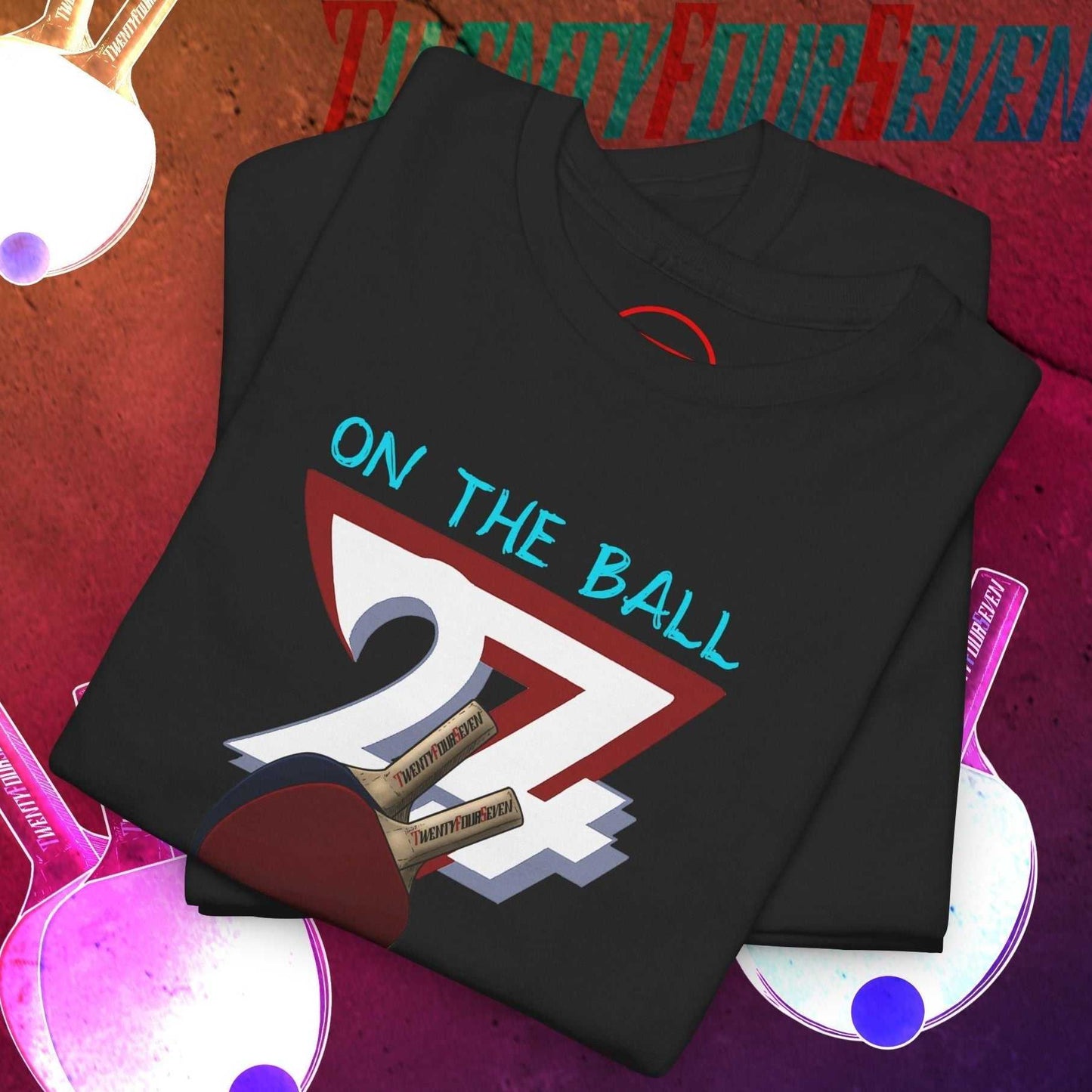 Black table tennis t-shirt with hand-drawn 90s style ping pong graphic and "On The Ball" text.