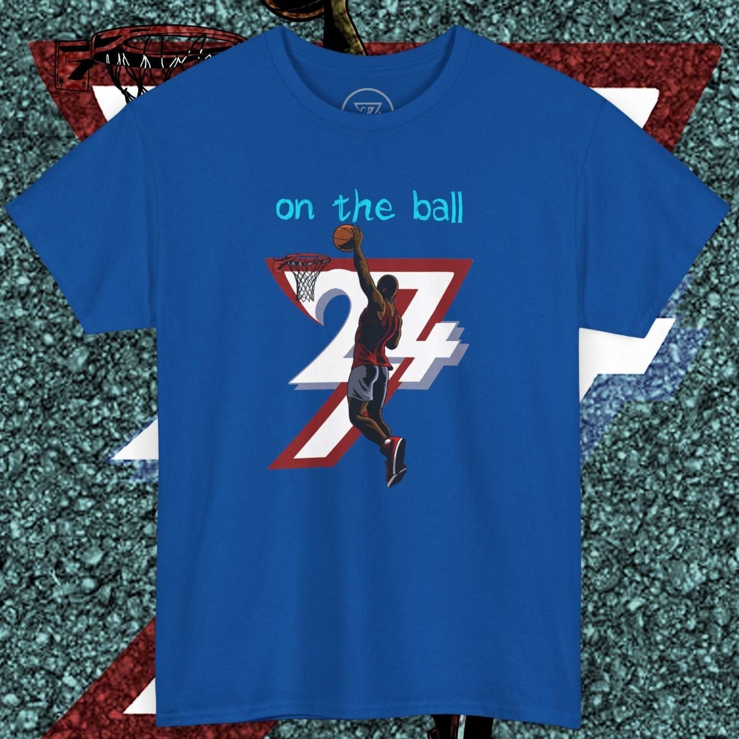 Blue 90s comic-style basketball tee with hand-drawn slam dunk graphic and "on the ball" text