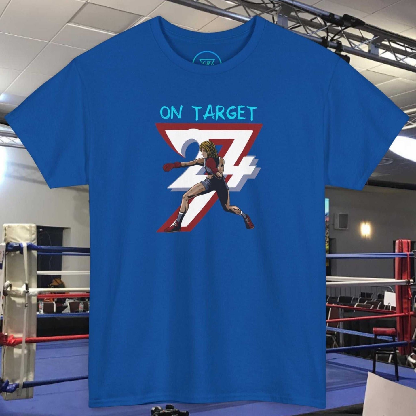 Blue Boxer Girl T-Shirt with hand-drawn boxing art and "ON TARGET" text, displayed in a boxing gym setting