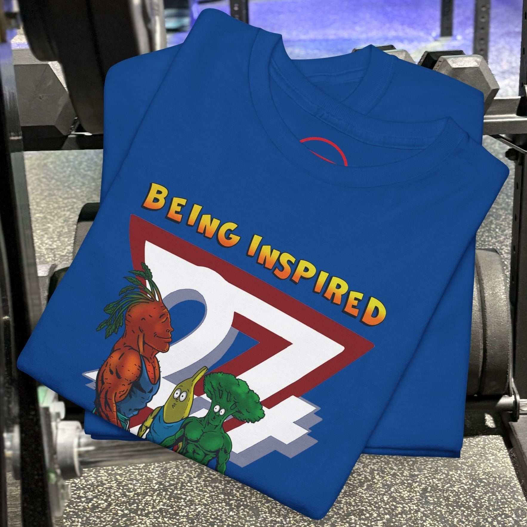 Blue Funny Carrot Gym Tee with cartoon carrot, banana, and broccoli fitness illustration on gym equipment background