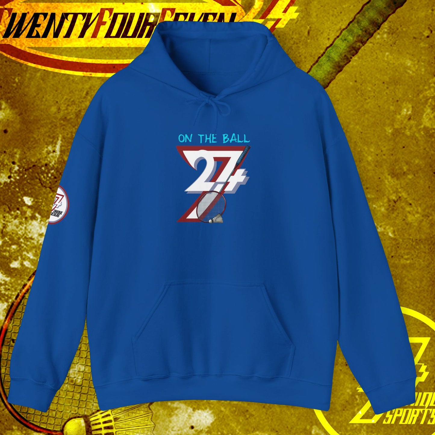 Blue badminton hoodie sweatshirt with "ON THE BALL 24/7" graphic, adjustable hood, and kangaroo pocket, designed for outdoor sports and casual wear