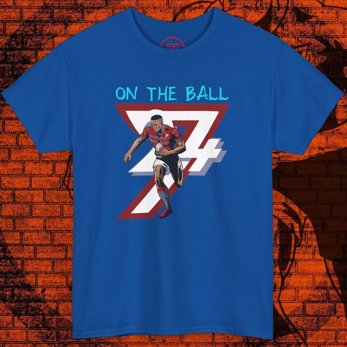 Blue comic-style rugby player t-shirt with "On The Ball" text and hand-drawn sports art
