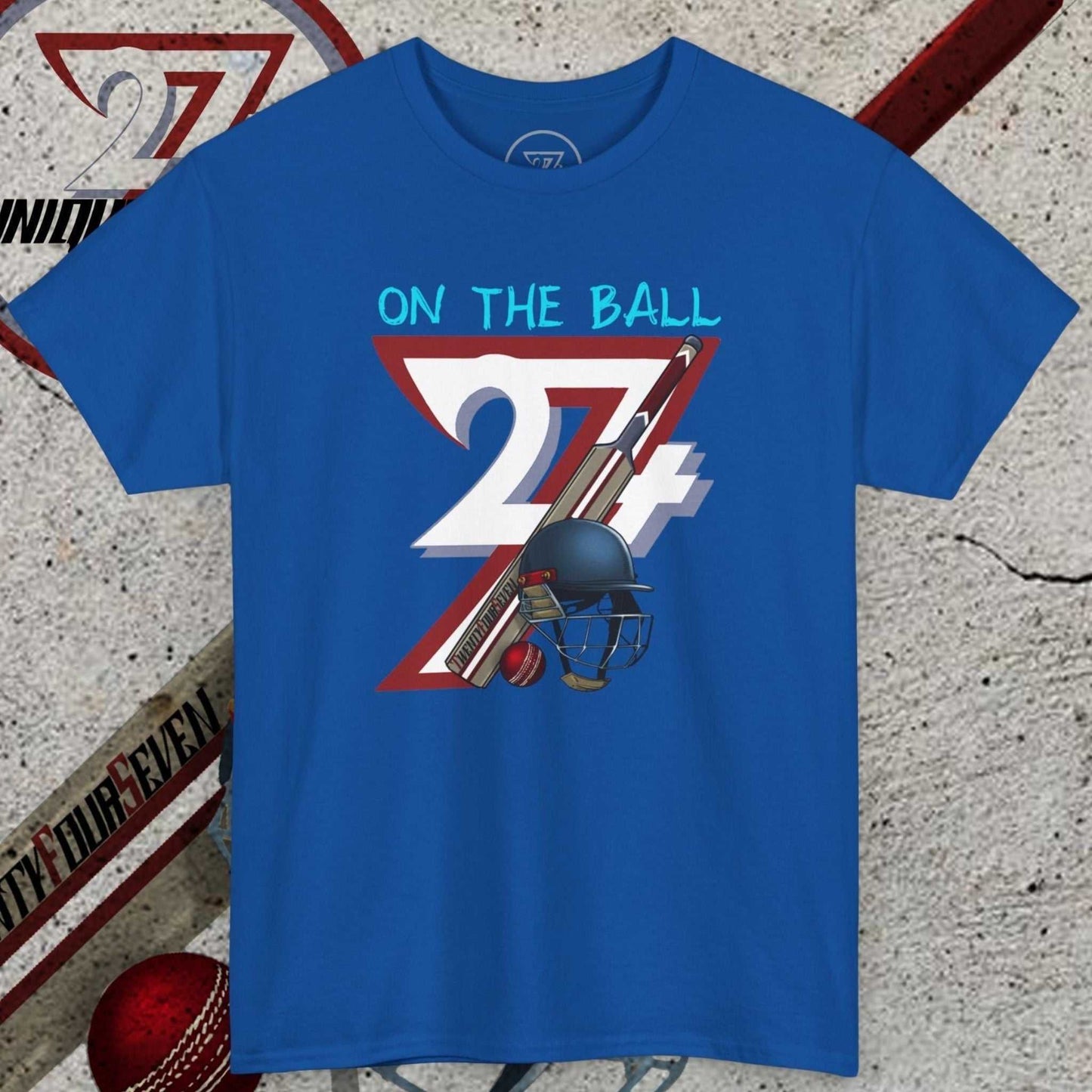 Blue cricket tee with hand-drawn 90s style cricket illustration and "On The Ball 24/7" text