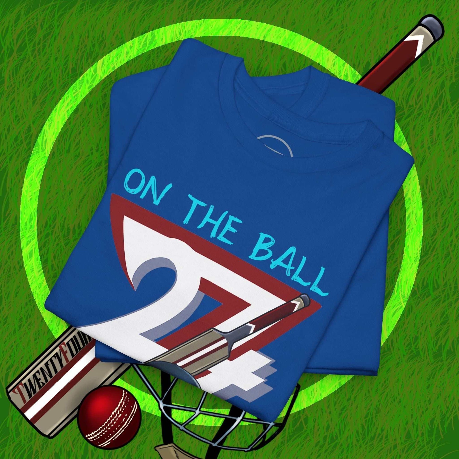 Blue cricket tee with hand-drawn "On The Ball 24/7" graphic, cricket bat, ball, and helmet design, 90s vintage style