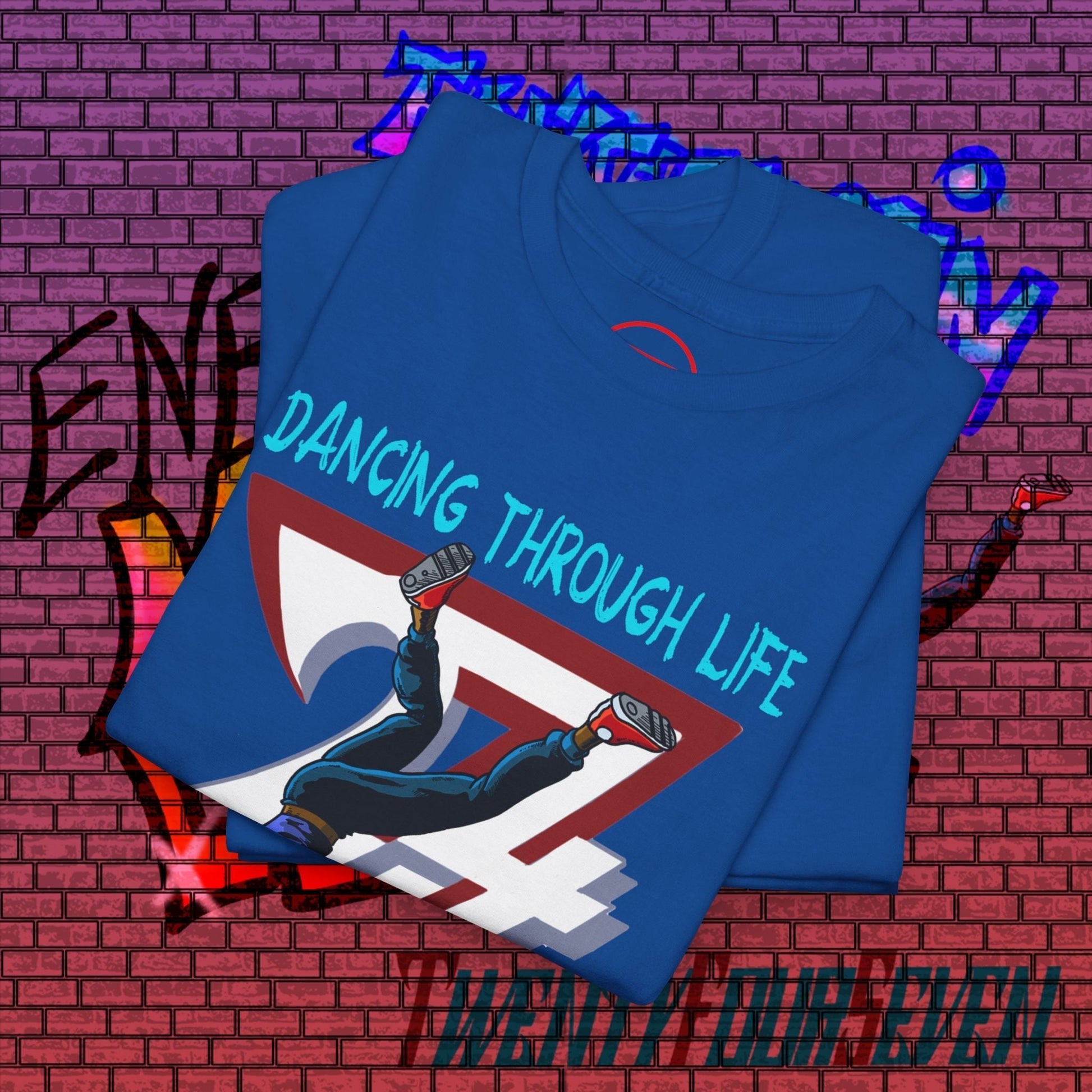 Blue dance graphic t-shirt with comic-style dancer illustration and "Dancing Through Life" text on front