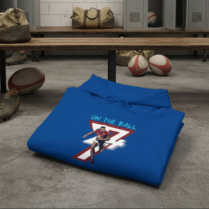 Blue rugby hoodie with vibrant hand-drawn rugby player design and "ON THE BALL" text