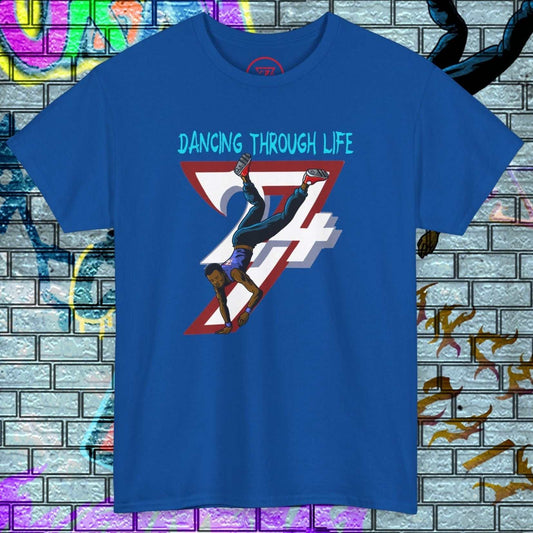 Blue street dance graphic t-shirt with hand-drawn breakdancer and "Dancing Through Life" text against a graffiti brick wall background