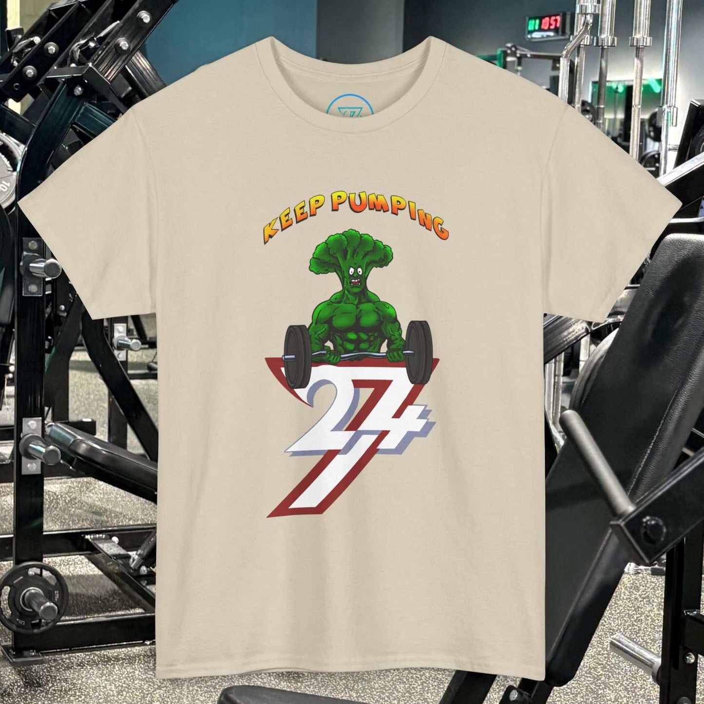 Broccoli weightlifting cartoon t-shirt with "Keep Pumping" gym design on beige cotton tee