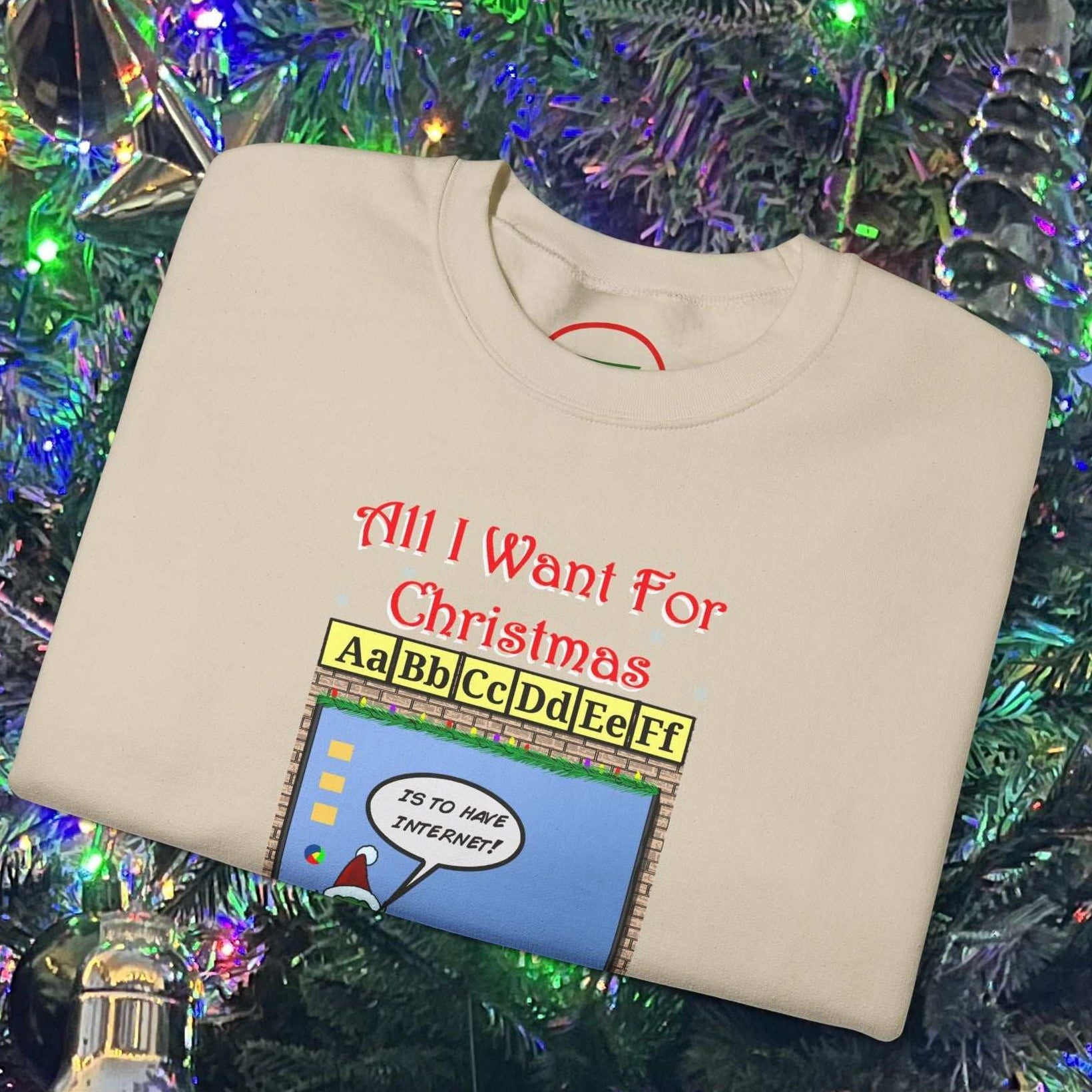 Christmas Teachers and Elves Sweatshirt with funny cartoon design folded on decorated Christmas tree background