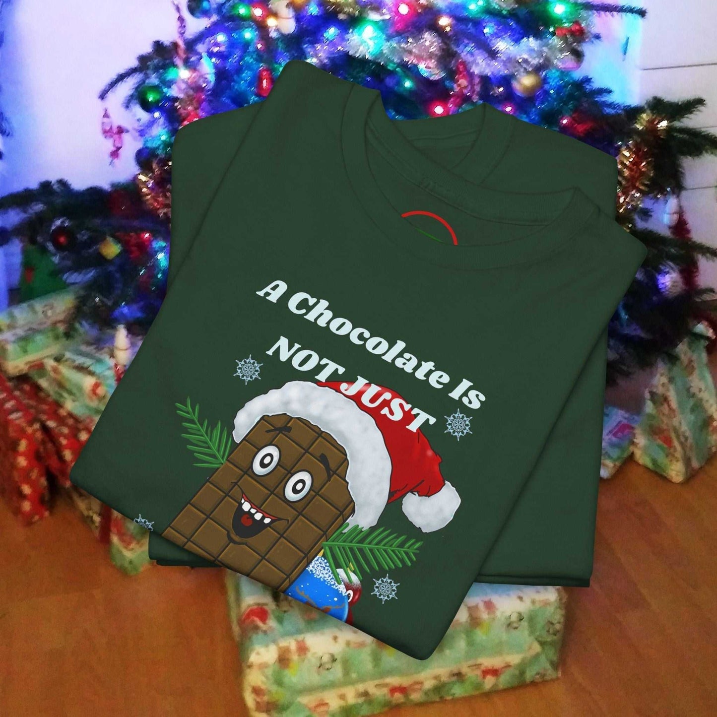 Green Christmas tee featuring a cartoon chocolate bar wearing a Santa hat with festive text.