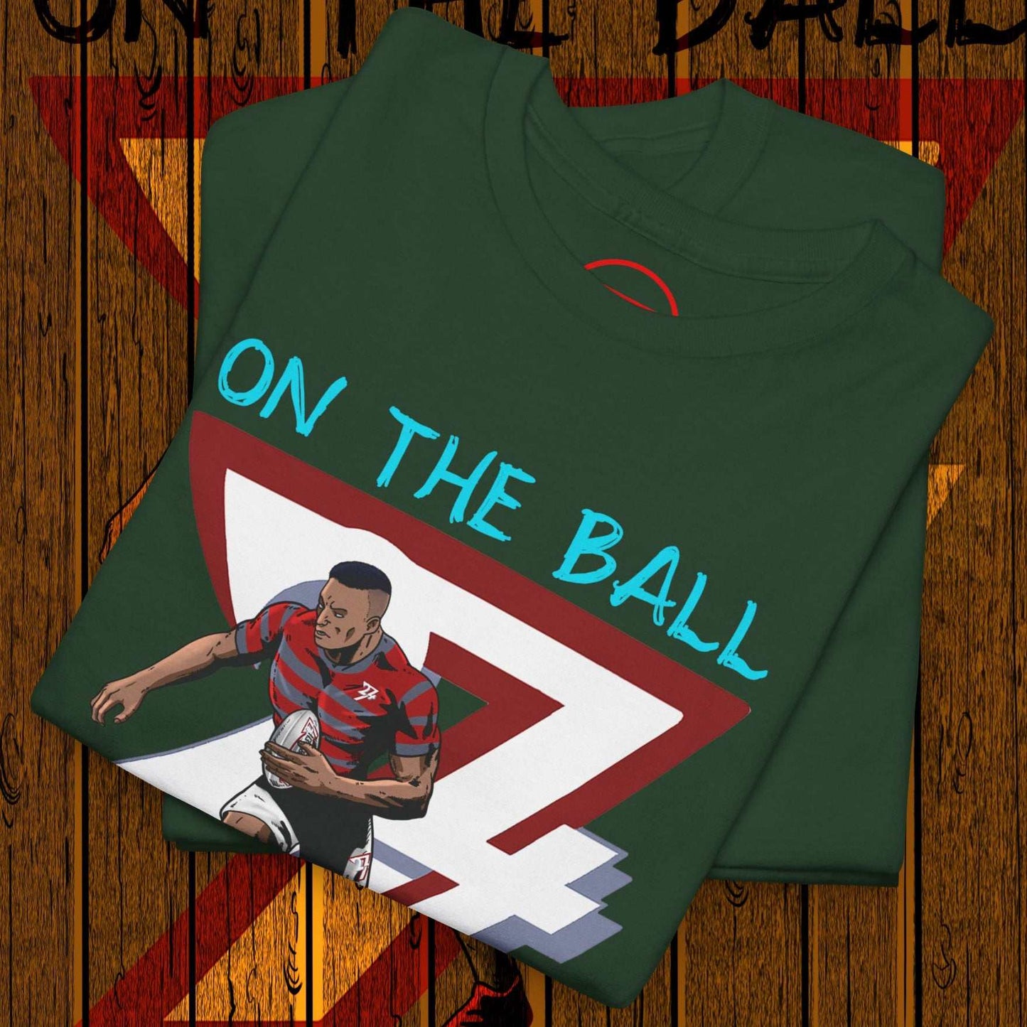 Comic-style rugby player t-shirt with hand-drawn illustration and "On The Ball" text on green fabric