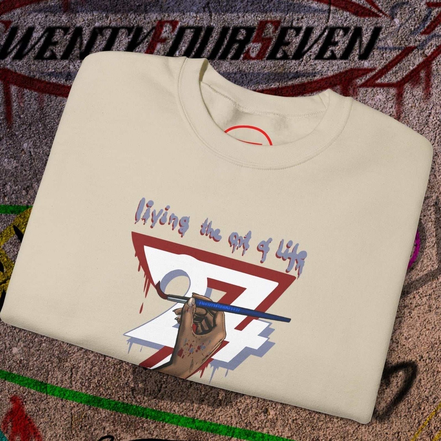 Cream artist brush sweatshirt with hand-drawn "living the art of life" design and paintbrush graphic