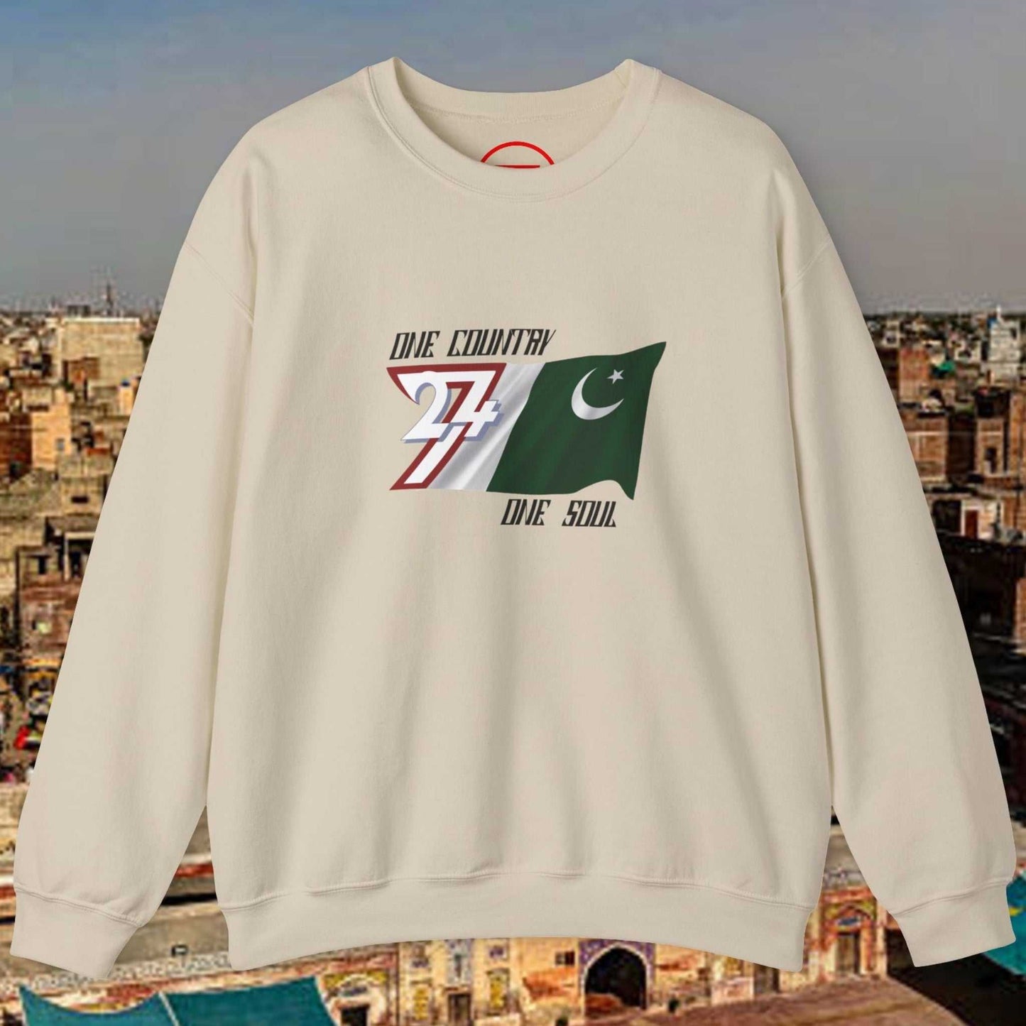 Cream crewneck sweatshirt with hand-drawn Pakistan flag and "One nation one goal one country one soul" slogan design