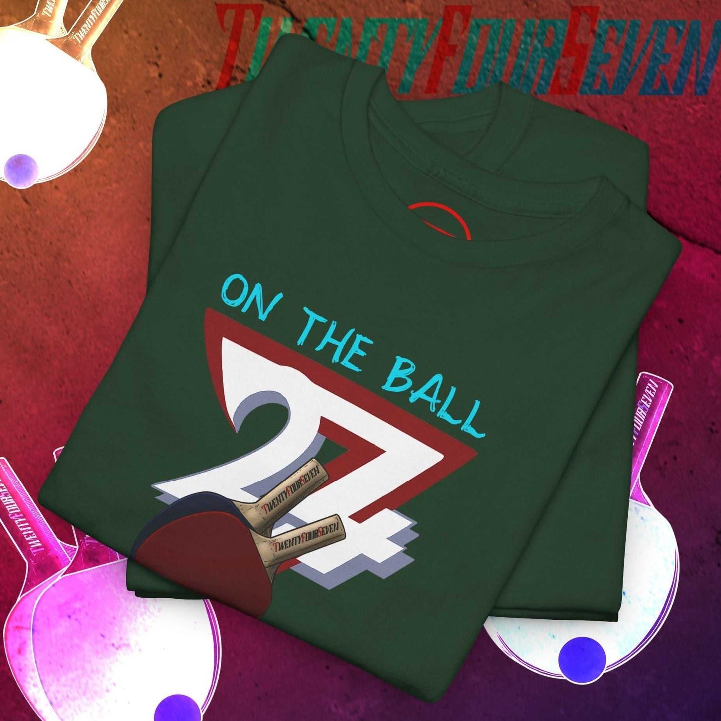 Dark green table tennis t-shirt with hand-drawn 90s style ping pong graphic and "On The Ball" text