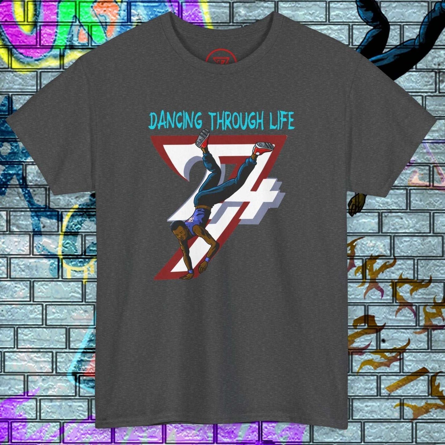 Dark grey dance graphic t-shirt with hand-drawn urban dancer illustration and "Dancing Through Life" text.