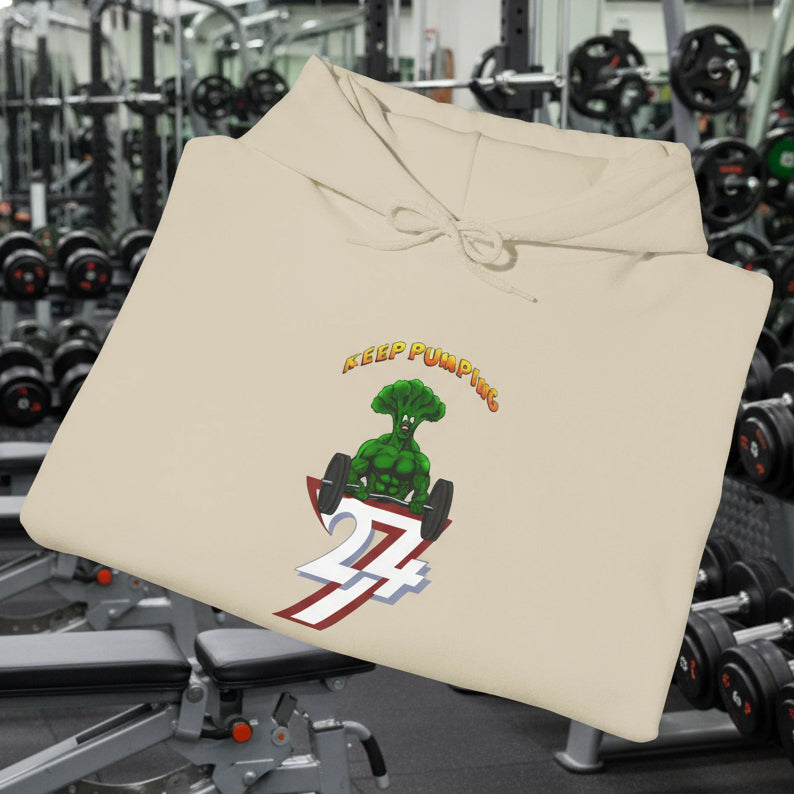 Folded beige broccoli hoodie with cartoon muscular broccoli graphic and "Keep Pumping" text on front