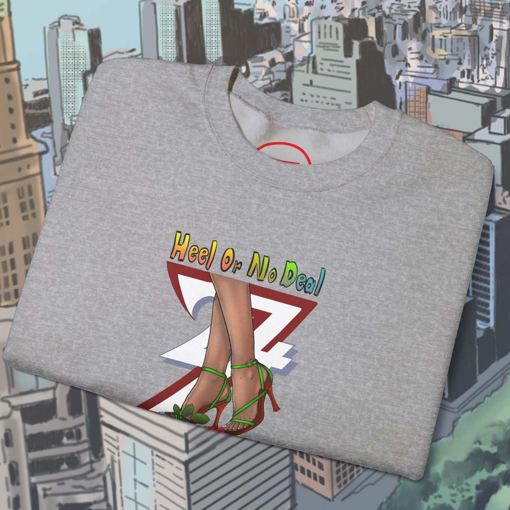 Folded gray sweatshirt with colorful heels and "Heel or No Deal" text design on urban background