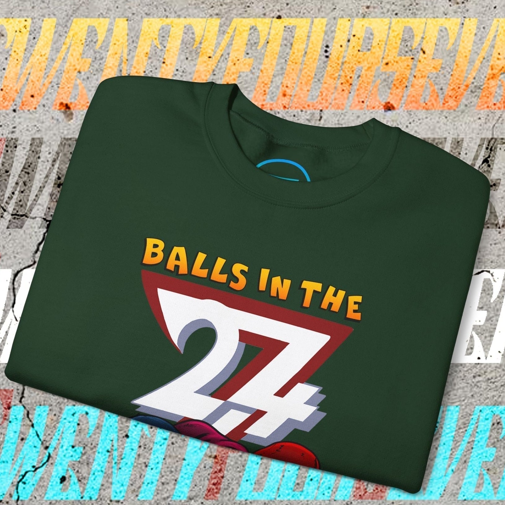 Folded green Balls In The Hood Sweatshirt with colorful 24 graphic and urban streetwear design on concrete background