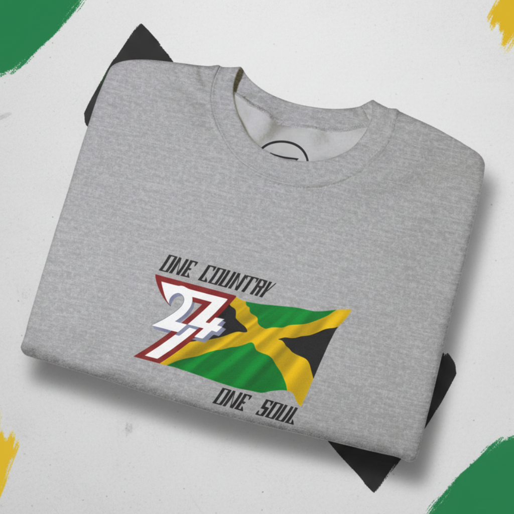 Folded grey Jamaica Flag Crewneck Sweatshirt with "One Country One Soul" text and vibrant hand-drawn flag design on chest