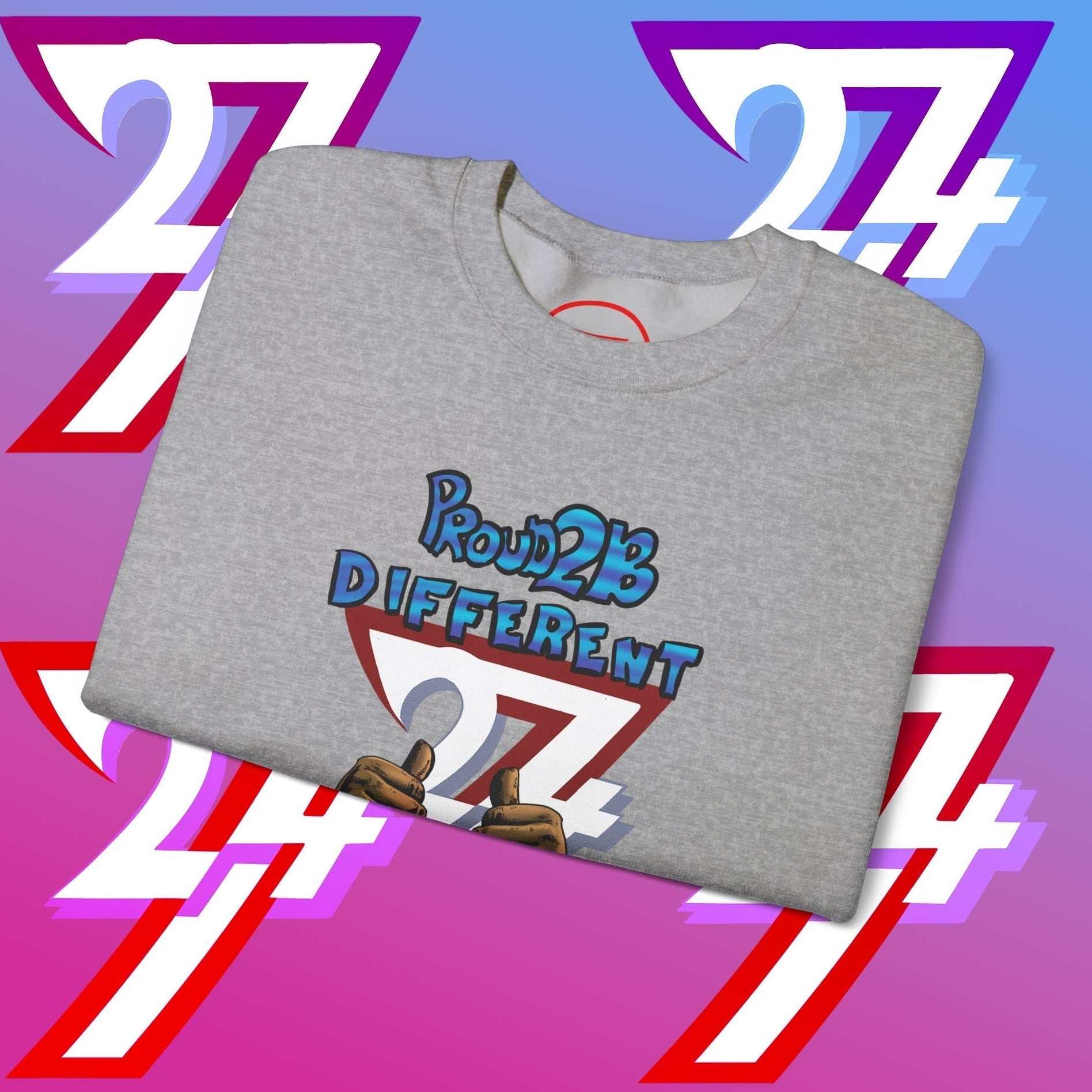 Folded grey crewneck sweatshirt with "Proud 2 B Different" slogan and artistic graphic design on front
