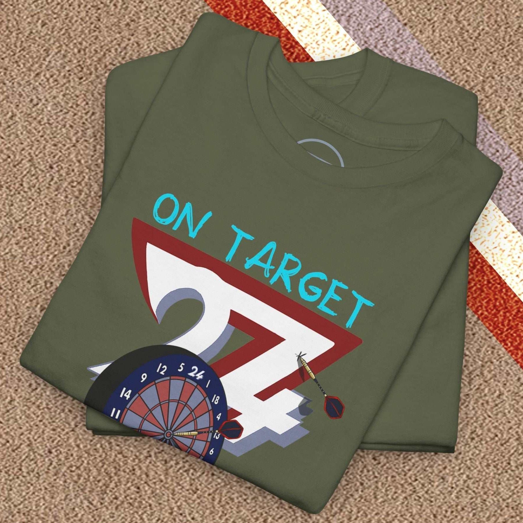 Folded olive green darts t-shirt with hand-drawn dartboard and "On Target" text design