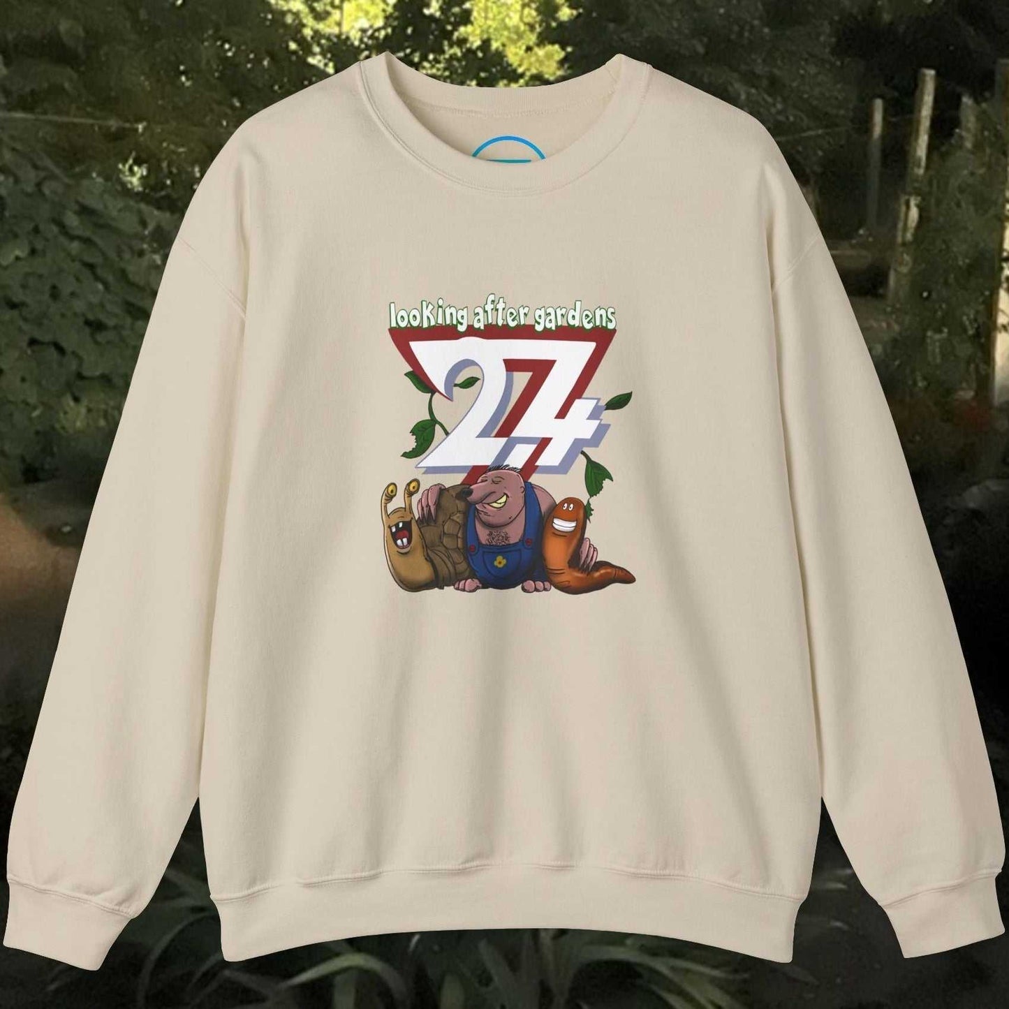 Funny cartoon sweatshirt with snail, mole, and slug gardening squad illustration on cream crewneck