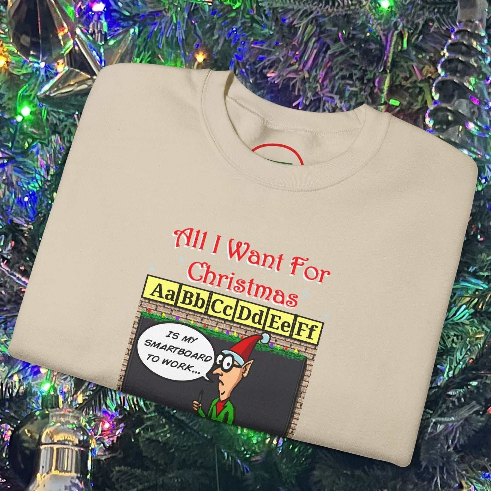 Funny cartoon teacher Christmas sweatshirt with holiday classroom design and festive text on beige fabric.