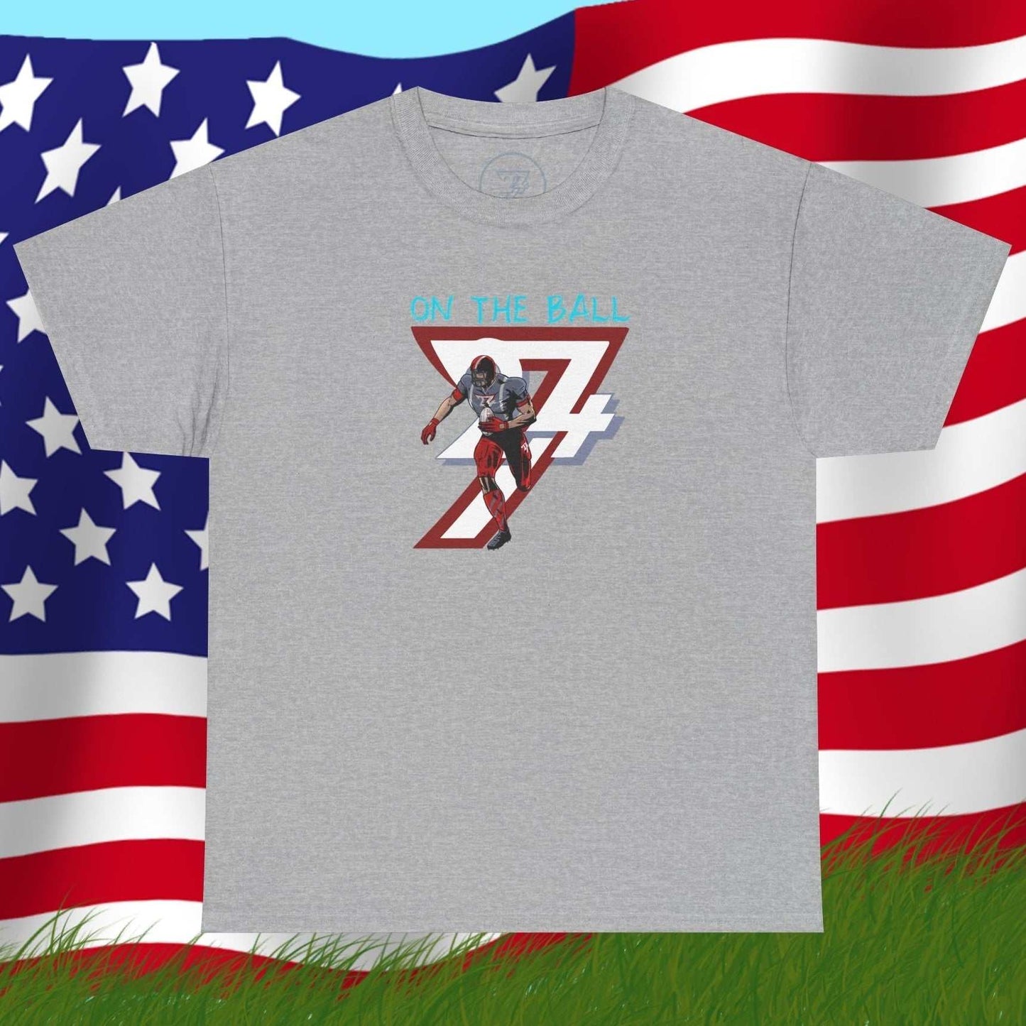 Gray American football tee with hand-drawn comic-style player graphic and "On The Ball" text on chest