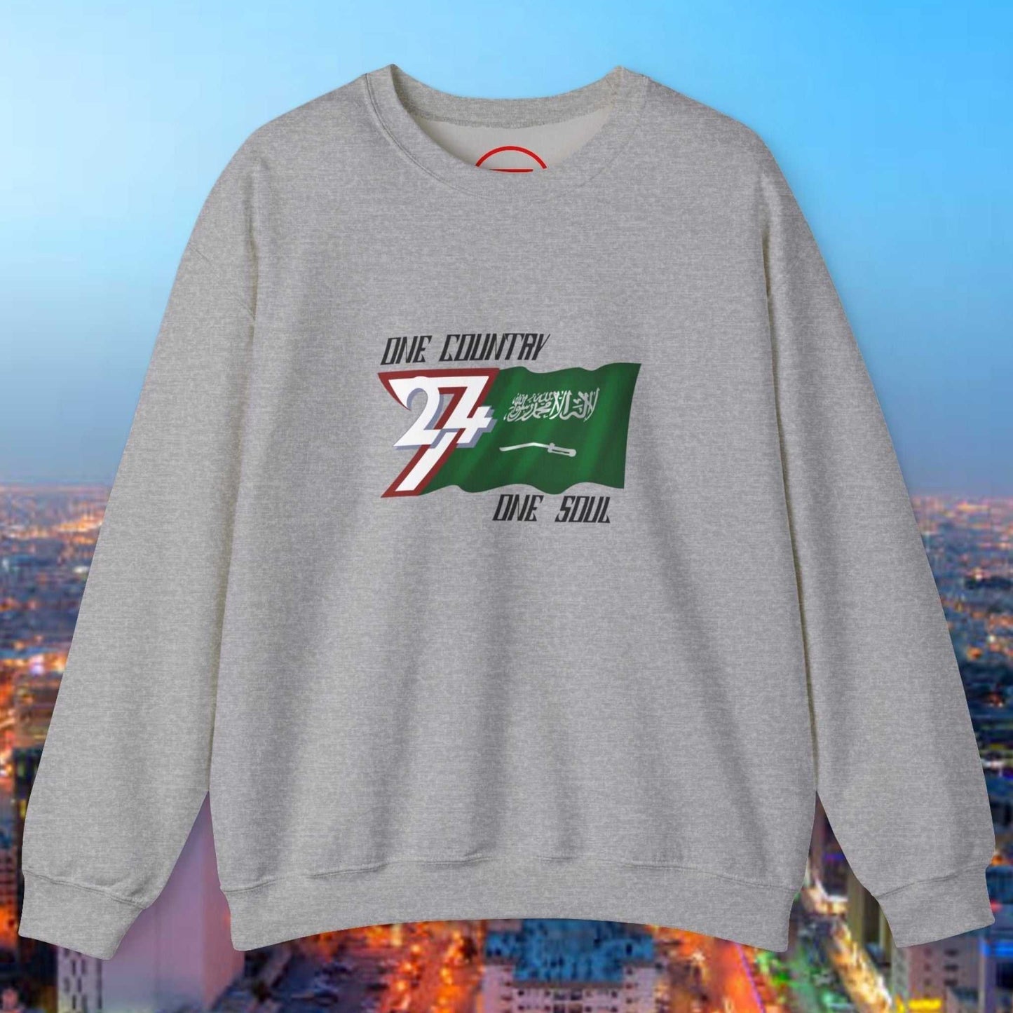 Gray crewneck sweatshirt with vibrant hand-drawn Saudi Arabia flag and "One Country One Soul" text design.