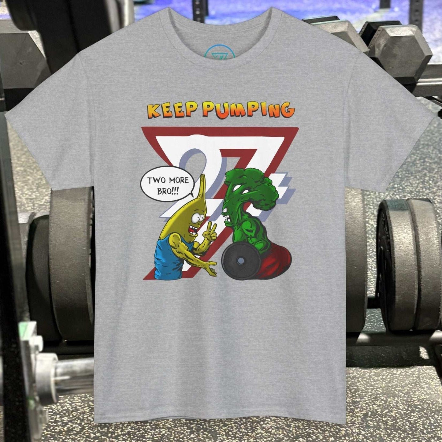 Gray funny broccoli gym tee with cartoon broccoli and banana lifting weights and "Keep Pumping" text on chest
