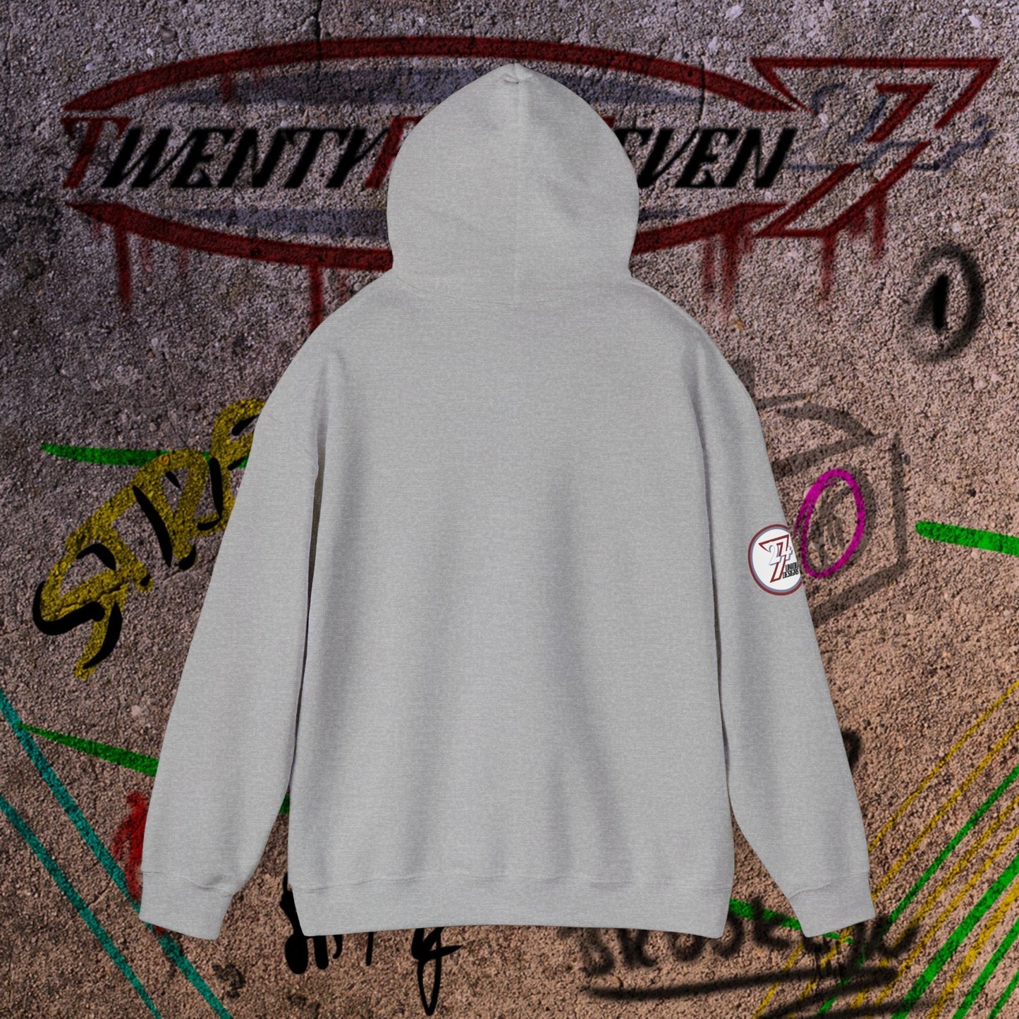Gray streetwear hoodie with hood and long sleeves against graffiti wall background