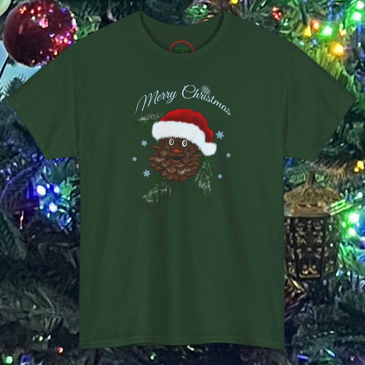 Green Santa Pinecone Tee with hand-drawn pinecone wearing Santa hat and "Merry Christmas" text in festive holiday setting