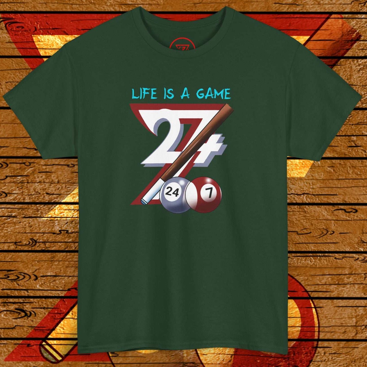 Green billiards tee with hand-drawn pool game design featuring "Life is a Game" text and billiard balls.