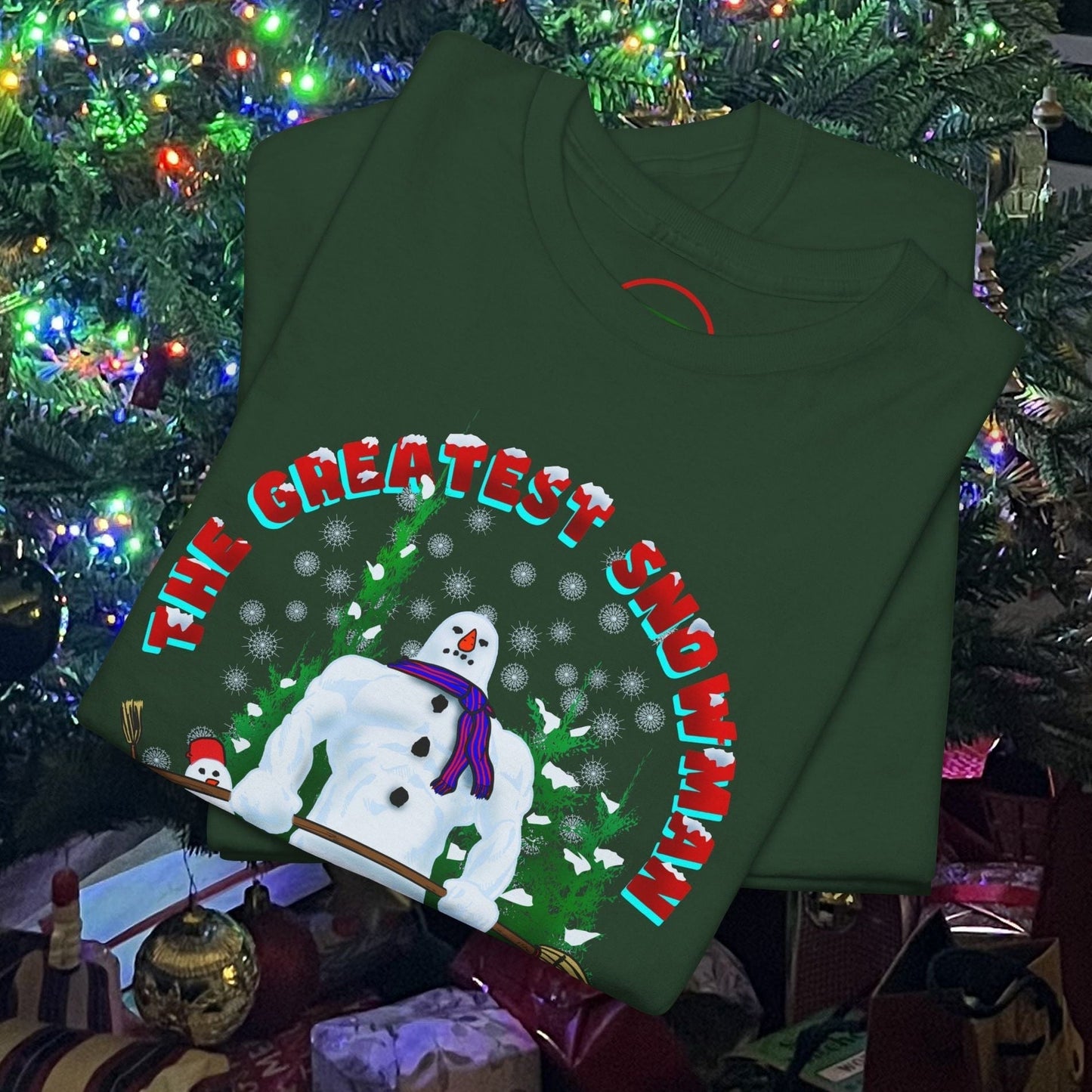 Green snowman gym t-shirt with cartoon snowman lifting dumbbells and festive text "The Greatest Snowman" perfect for Christmas workouts
