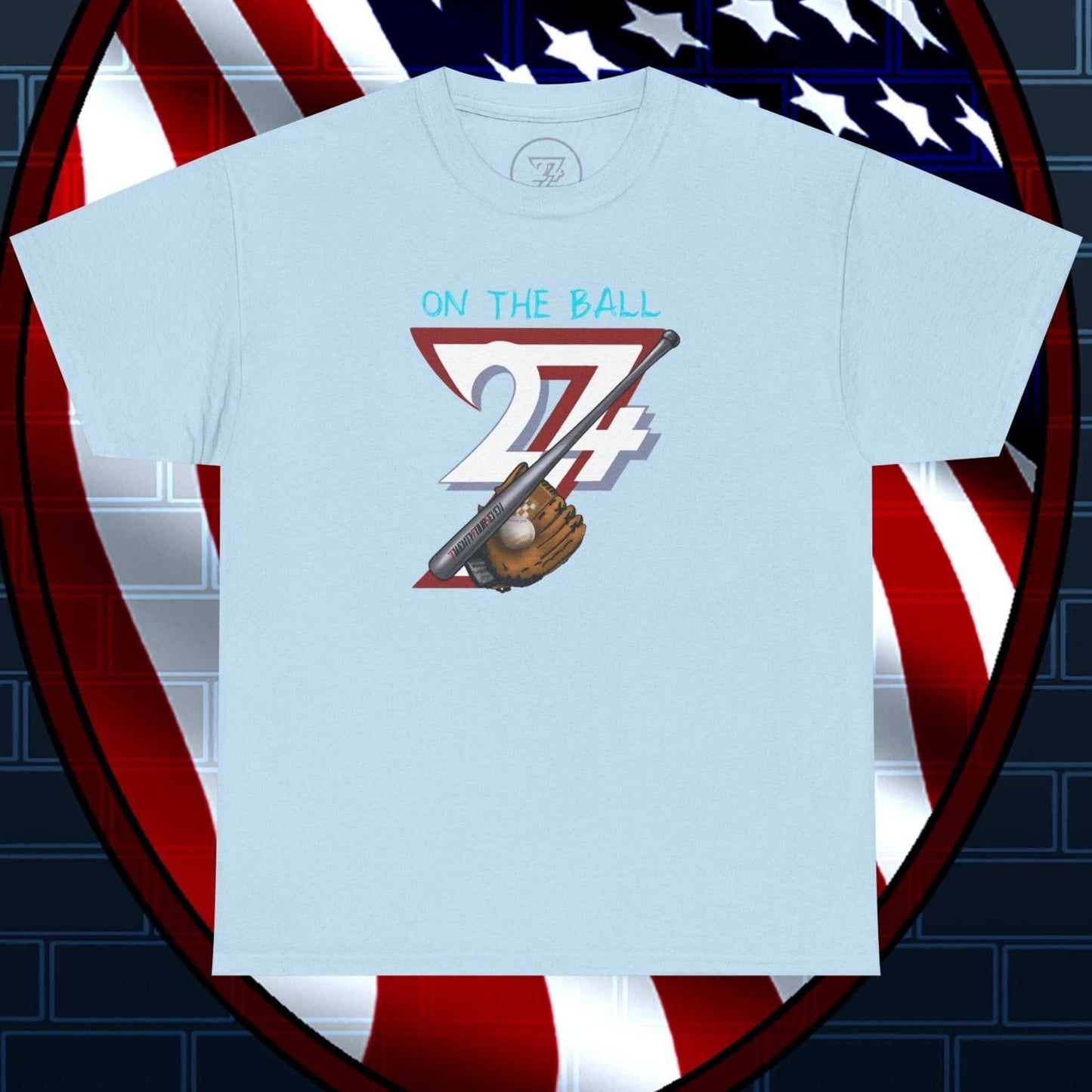 Light blue Baseball Illustrated Tee with hand-drawn baseball glove and bat design on front, comfortable cotton fabric, styled against an American flag shield backdrop.