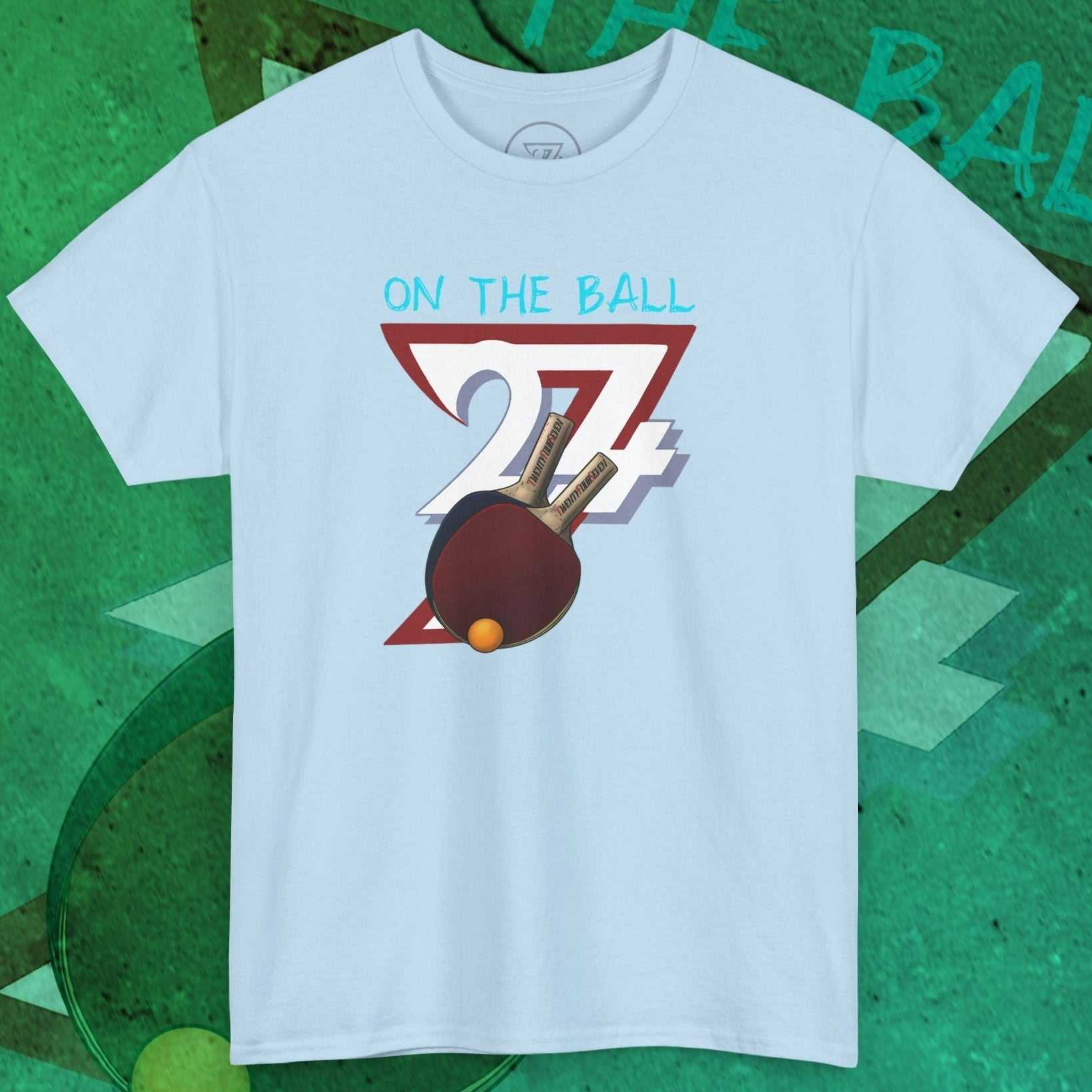 Light blue Ping-Pong T-Shirt with hand-drawn paddle and ball illustration and "On The Ball 24/7" text design