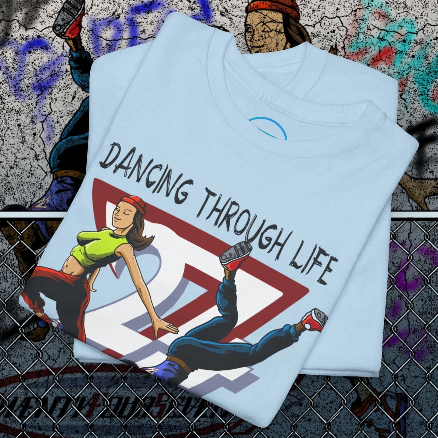 Light blue Street Dance Comic Art T-Shirt with vibrant comic-style illustration and "Dancing Through Life" text.