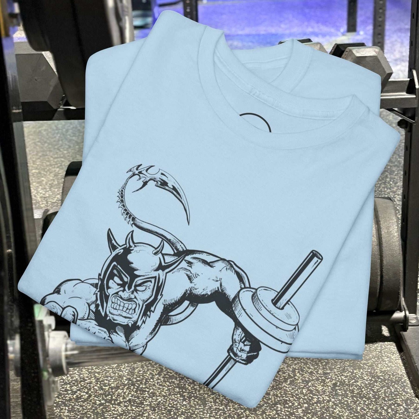 Light blue gym tee with hand-drawn comic-style fantasy character lifting weights on front.
