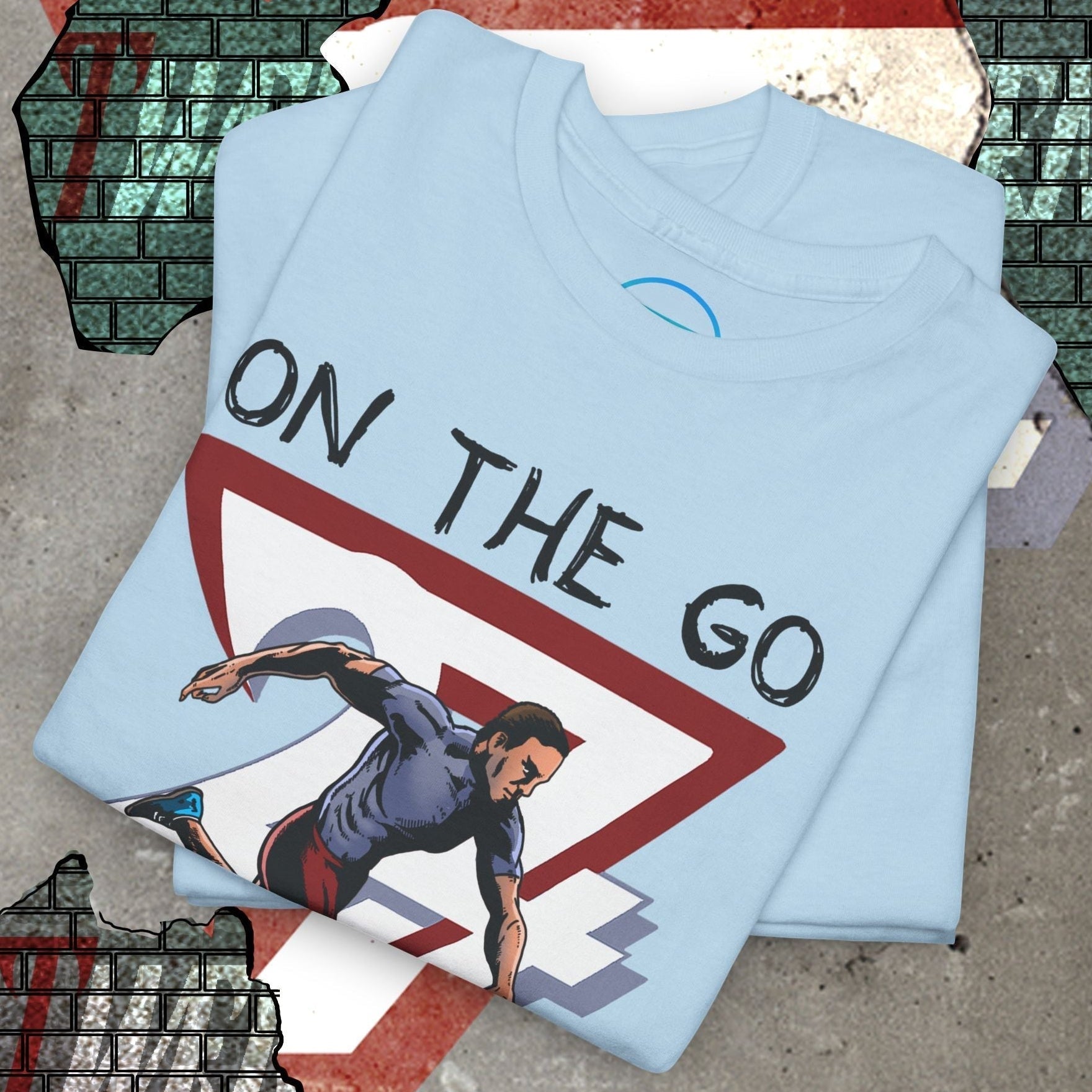 Light blue running sports tee with hand-drawn runner illustration and "On The Go" text printed on front